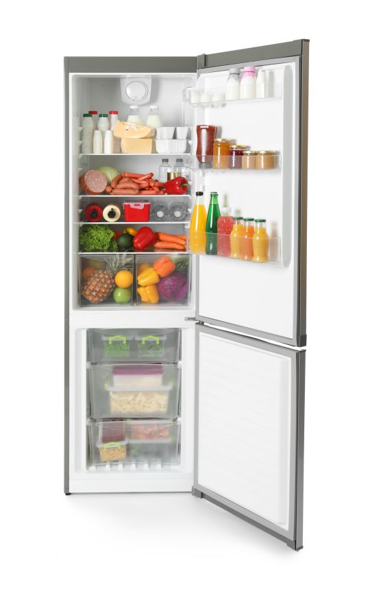 Open refrigerator with many different products on white background